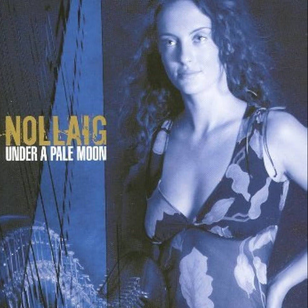 Album cover with a woman and text 'Nollaig Under a Pale Moon' on a blue and black background.