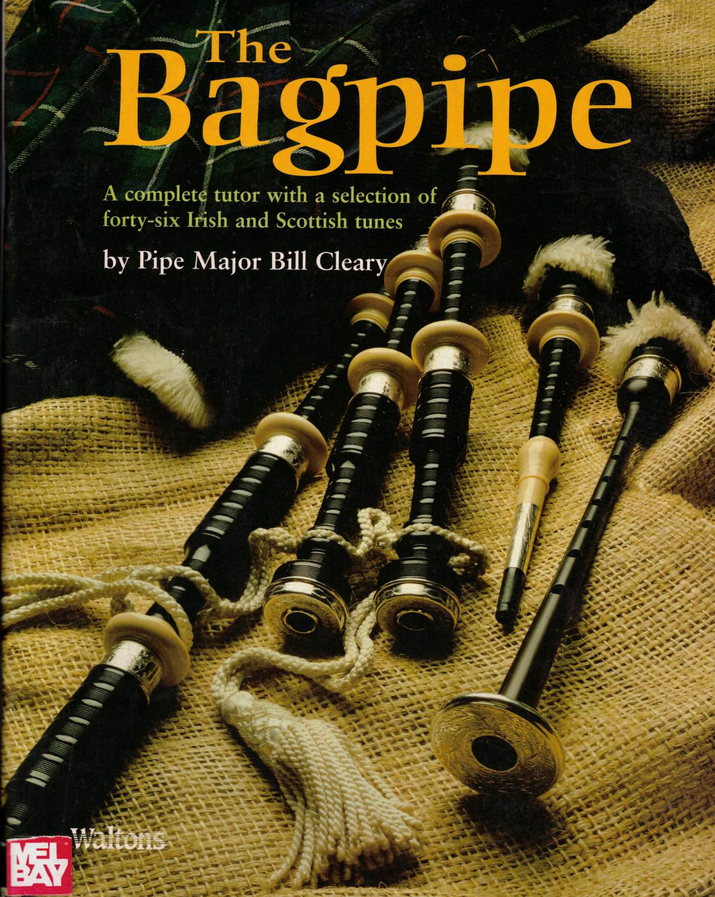Bagpipe parts scattered over a canvas cloth with the title "The Bagpipe"