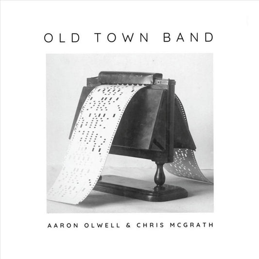 Album cover for 'Old Town Band' by Aaron Olwell & Chris McGrath featuring a vintage band machine.