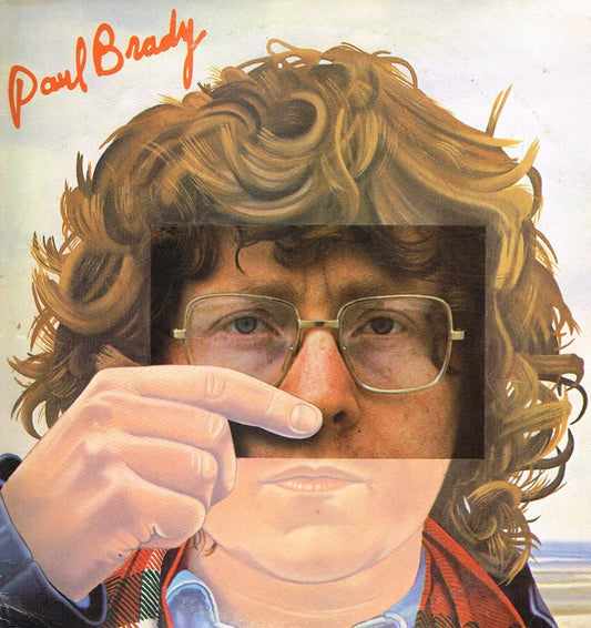 Album cover with a person holding glasses, featuring the name 'Paul Brady'.